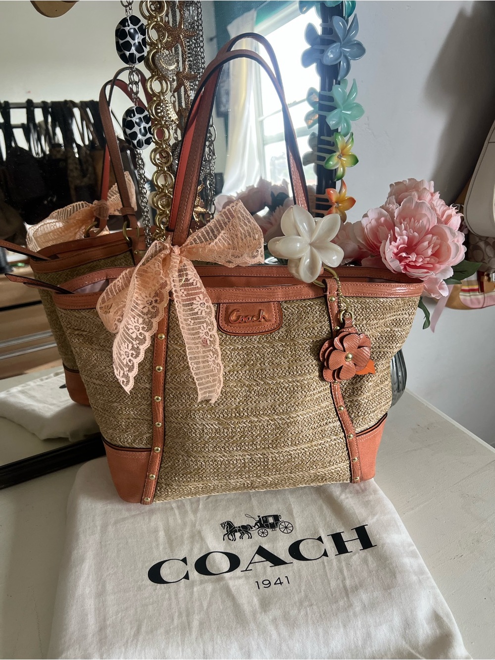 Coach Straw Tote with Coral Leather Trim and Floral Charm
